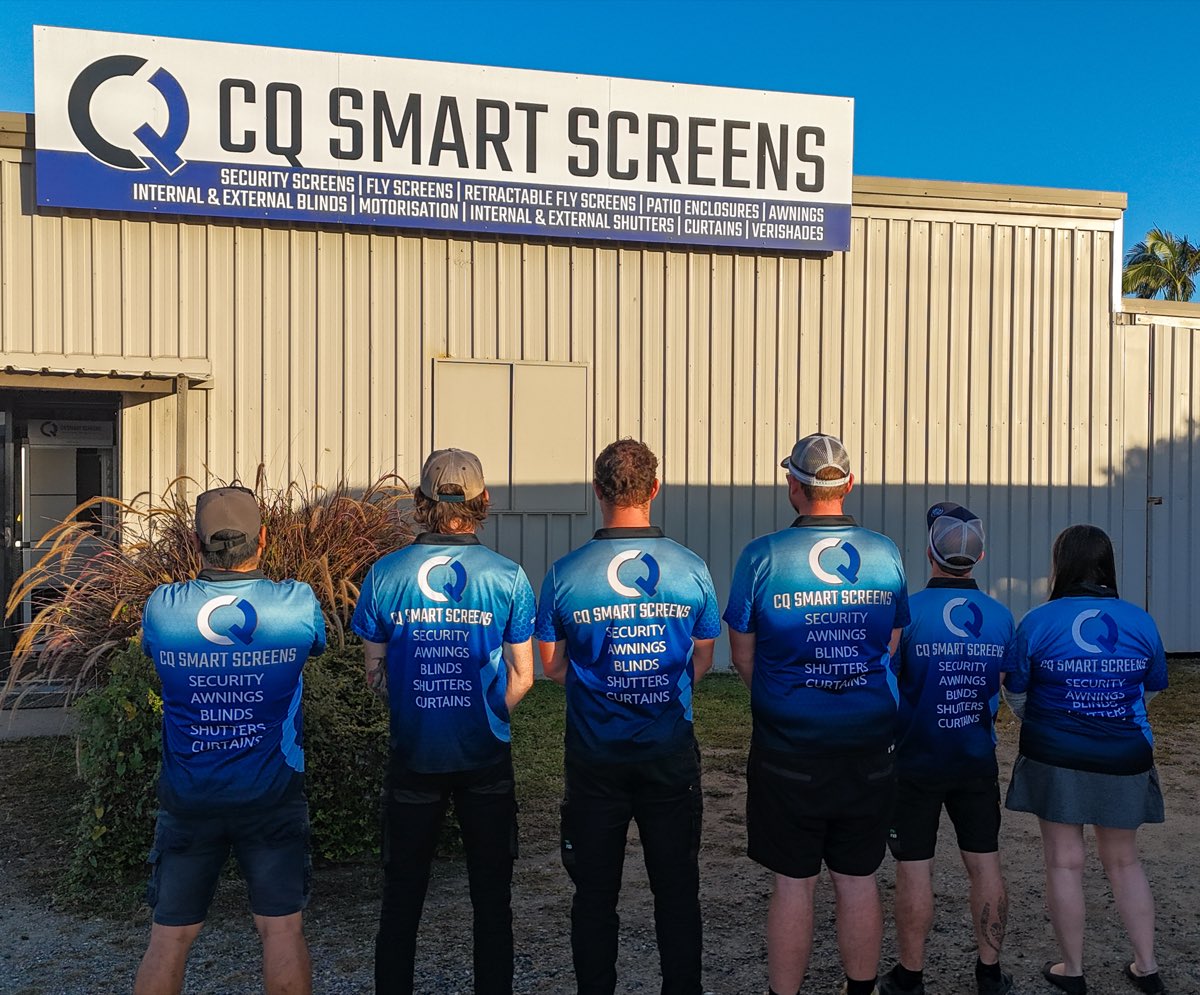 The CQ Smart Screens crew outside their Yeppoon shopfront in branded shirts